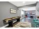 Spacious game room with shuffleboard table, arcade games, ping pong table, and bar seating at 10896 Fairwoods Dr, Fishers, IN 46037