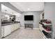 Finished basement kitchenette with white cabinetry, sink, and mini-fridge; ideal for snacks and drinks at 10896 Fairwoods Dr, Fishers, IN 46037