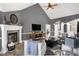 Spacious living room with fireplace, high ceilings, neutral color scheme, and wood floors, offering a stylish and comfortable space at 10896 Fairwoods Dr, Fishers, IN 46037