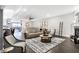 Cozy living area with modern furniture, fireplace, and access to dining area at 10896 Fairwoods Dr, Fishers, IN 46037