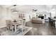 Open-concept living and dining area featuring modern furnishings and stylish decor at 10896 Fairwoods Dr, Fishers, IN 46037