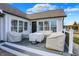 Inviting covered patio with comfortable seating, perfect for relaxation and entertaining with natural light at 10896 Fairwoods Dr, Fishers, IN 46037