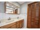 Bathroom with double vanity features tile floors and paneled linen closet at 118 Beechwood Dr, Westfield, IN 46074