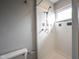 Bathroom shower with white tile, shower head, soap dish, and a window above the shower at 118 Beechwood Dr, Westfield, IN 46074