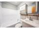 Cozy bathroom featuring vanity, sink, medicine cabinet, and shower/tub with white tile surround at 118 Beechwood Dr, Westfield, IN 46074