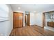 Bedroom with hardwood floors and view to bathroom with double vanity at 118 Beechwood Dr, Westfield, IN 46074