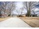 Attractive single-story home with a long driveway surrounded by mature trees at 118 Beechwood Dr, Westfield, IN 46074