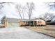 Well-kept brick ranch with attached garage, inviting curb appeal, and a gravel driveway at 118 Beechwood Dr, Westfield, IN 46074