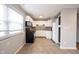 Cozy kitchen features white cabinets, backsplash, stainless steel appliances, and tile flooring at 118 Beechwood Dr, Westfield, IN 46074