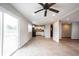 Open-concept living room and kitchen area with tile flooring and sliding glass door to the backyard at 118 Beechwood Dr, Westfield, IN 46074