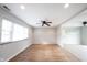 Open living room with hardwood floors, a ceiling fan, and lots of natural light at 118 Beechwood Dr, Westfield, IN 46074