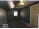 Cozy bedroom featuring neutral walls and carpeted flooring, illuminated by natural light at 1311 E Hines St, Muncie, IN 47303