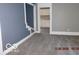 Cozy living room with neutral walls and view into Kitchen at 1311 E Hines St, Muncie, IN 47303