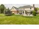 Spacious backyard featuring outdoor seating, patio, grill, and trampoline at 14297 Matt St, Carmel, IN 46033