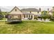 A gorgeous backyard with a new trampoline and patio furniture sets, perfect for Gathering fun at 14297 Matt St, Carmel, IN 46033