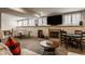 Spacious basement featuring a ping pong table, game table, fireplace, and comfortable seating area at 14297 Matt St, Carmel, IN 46033