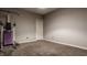 A view of the basement with carpet, neutral paint, and exercise equipment at 14297 Matt St, Carmel, IN 46033