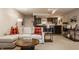 Finished basement with a stylish bar area, comfortable sofa with red throw pillows, and ample room for entertaining at 14297 Matt St, Carmel, IN 46033