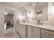 This bathroom features a floral accent wall and double vanity sinks with gold hardware and fixtures at 14297 Matt St, Carmel, IN 46033