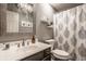Stylish bathroom with modern fixtures, decorative mirror, and patterned shower curtain provides a clean aesthetic at 14297 Matt St, Carmel, IN 46033