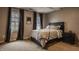 Neutral bedroom with windows and a bed with gray and white linens at 14297 Matt St, Carmel, IN 46033