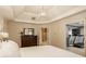 Comfortable bedroom featuring a dresser, en suite bath, and private exercise area at 14297 Matt St, Carmel, IN 46033