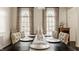 Spacious dining room with long table, stylish arched windows, and decorative curtains, ideal for Gathering gatherings at 14297 Matt St, Carmel, IN 46033