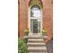 Charming brick facade with decorative plants and front door wreath at 14297 Matt St, Carmel, IN 46033