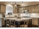 Updated kitchen boasts a large island, pendant lighting, and sleek stainless steel appliances at 14297 Matt St, Carmel, IN 46033