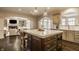 Kitchen offers seamless transition to living area and provides plentiful seating with island at 14297 Matt St, Carmel, IN 46033