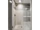 This modern shower features sleek glass doors and geometric tiling at 14297 Matt St, Carmel, IN 46033