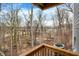 Balcony view of wooded area and bridge in the distance on a sunny day at 14474 Treasure Creek Ln, Fishers, IN 46038
