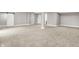 Finished basement with neutral walls and carpet with a barn door, and an architectural column at 14474 Treasure Creek Ln, Fishers, IN 46038