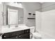 Modern bathroom featuring a vanity with a large mirror, a toilet, and a shower with a bathtub at 14474 Treasure Creek Ln, Fishers, IN 46038