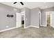 Large carpeted bedroom with natural light and an open doorway to the Primary bath at 14474 Treasure Creek Ln, Fishers, IN 46038