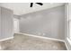 Bright bedroom featuring neutral paint, carpet, and a door to other areas of the house at 14474 Treasure Creek Ln, Fishers, IN 46038