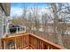 A wooden deck with a scenic view of the river and surrounding trees offers a peaceful outdoor space at 14474 Treasure Creek Ln, Fishers, IN 46038