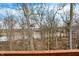 A view from a deck overlooking river and woodlands creates a tranquil ambiance and outdoor enjoyment at 14474 Treasure Creek Ln, Fishers, IN 46038