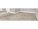 Neutral carpet, grey walls, and white trim in this spacious room at 14474 Treasure Creek Ln, Fishers, IN 46038