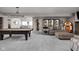 Finished basement with a pool table, comfortable seating, and stylish decor at 15675 Woodford Dr, Westfield, IN 46074