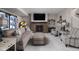 Cozy finished basement with a fireplace, comfortable seating, and a classic jukebox at 15675 Woodford Dr, Westfield, IN 46074