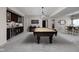Entertaining space with a pool table, wet bar, and dining area at 15675 Woodford Dr, Westfield, IN 46074