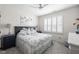 Cozy bedroom with a ceiling fan and a large window with charming shutters at 15675 Woodford Dr, Westfield, IN 46074