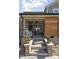 Cozy covered patio with comfortable chairs, wood flooring, and a ceiling fan, perfect for relaxing in the shade at 15675 Woodford Dr, Westfield, IN 46074