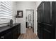 Hallway featuring a decorative console table, modern lighting, and a half bathroom at 15675 Woodford Dr, Westfield, IN 46074