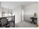 Bright hallway features neutral walls, plush carpeting, and stylish furnishings at 15675 Woodford Dr, Westfield, IN 46074