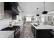 Well-lit kitchen featuring an island and stainless steel appliances, with dining area at 15675 Woodford Dr, Westfield, IN 46074