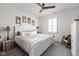 Warm and inviting bedroom with a ceiling fan, shutters, and neutral decor at 15675 Woodford Dr, Westfield, IN 46074