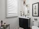 Stylish powder room features a modern vanity, unique lighting, and decorative accents at 15675 Woodford Dr, Westfield, IN 46074