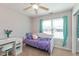 Cozy bedroom featuring a bed, desk, and natural lighting at 160 Tracy Ridge Blvd, Whiteland, IN 46184